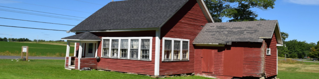 Color photograph of the Reed Schoolhouse, located next to the current Town Offices.